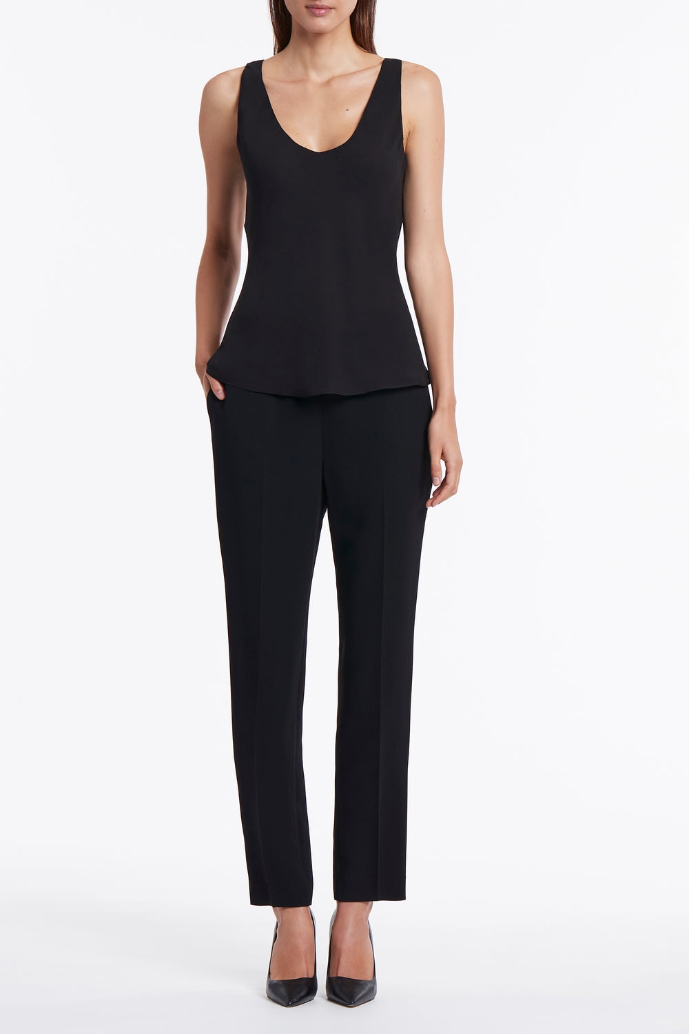 Image of a model wearing Tops. Product name - Black Georgette Scoop Cami in Black colour by brand - Carla Zampatti