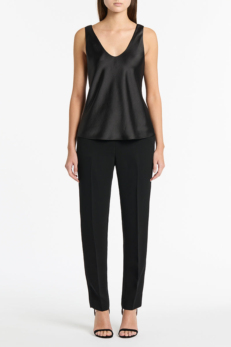 Image of a model wearing Pants. Product name - Black Crepe Classic Slim Pant in Black Cz_Autumn_23 colour by brand - Carla Zampatti