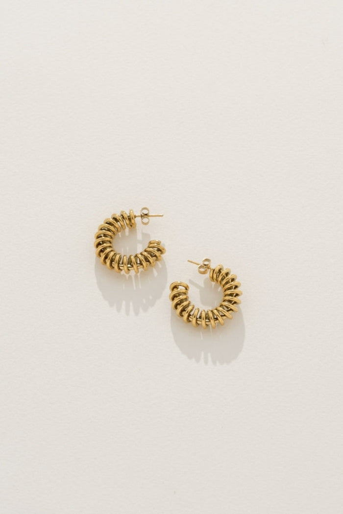 Image of Earrings. Product name - Spiral Hoop Earrings in Gold colour by brand - Reliquia Jewellery