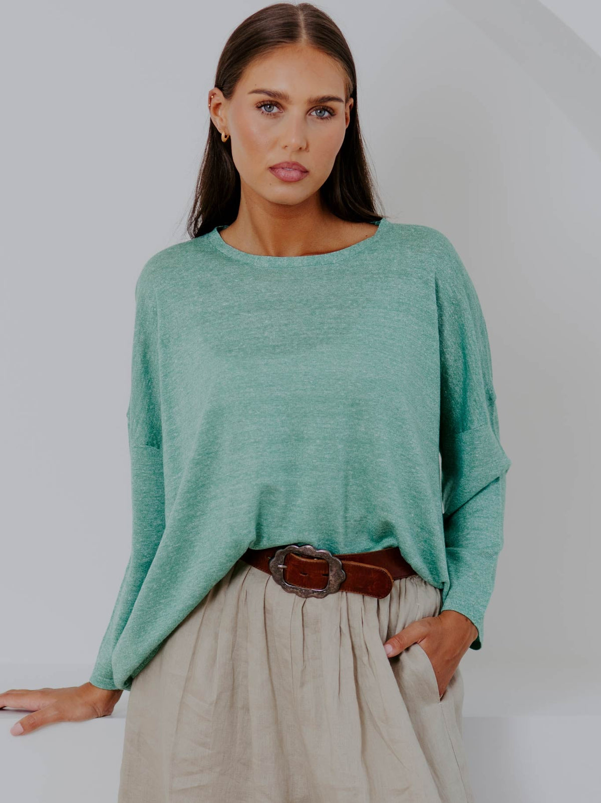 Image of a model wearing Outerwear. Product name - Bridge & Lord Boxy Relaxed Pullover in Emerald colour by brand - Bridge And Lord