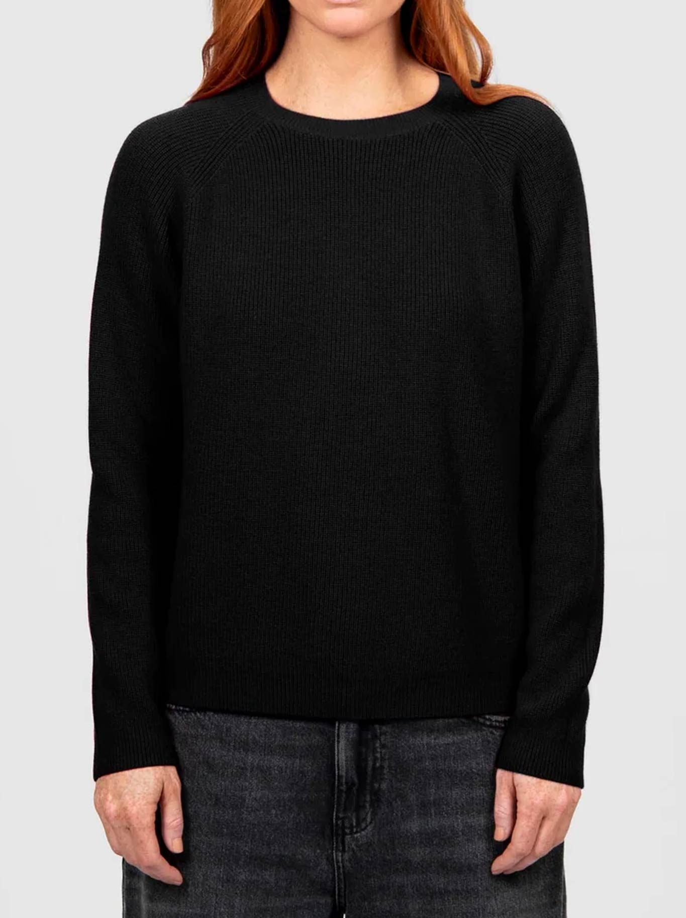 Image of a model wearing Outerwear. Product name - BRIDGE & LORD RIBBED RAGLAN PULLOVER in Black colour by brand - Bridge And Lord