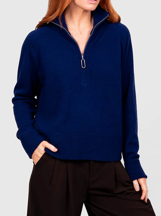 Image of a model wearing Outerwear. Product name - BRIDGE & LORD 1/2 ZIP RAGLAN WITH CUFFS in Black colour by brand - Bridge And Lord