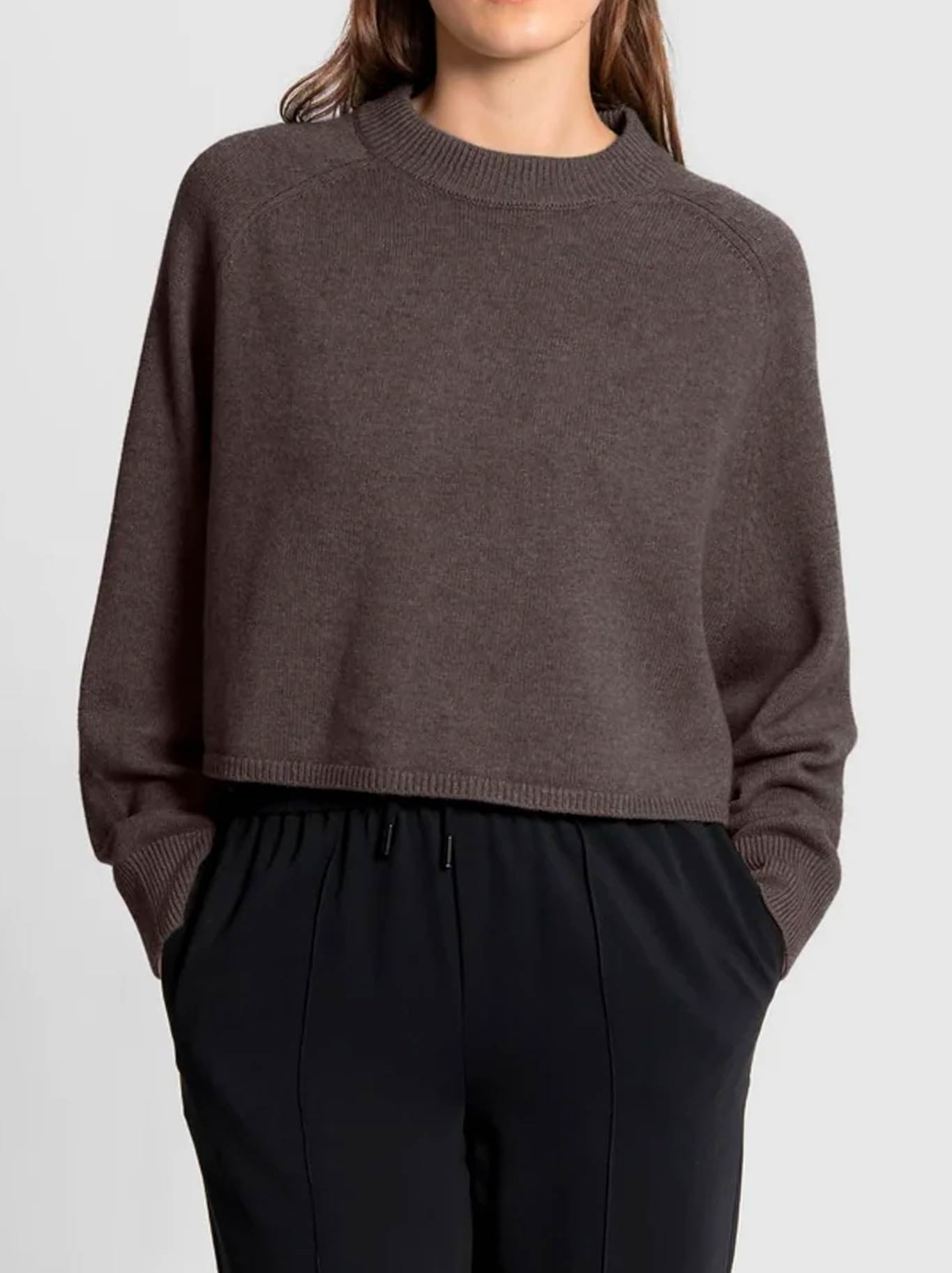Image of a model wearing Outerwear. Product name - FIELDS BATWING SADDLE SHOULDER PULLOVER in Coffee Bean colour by brand - Fields Knitwear