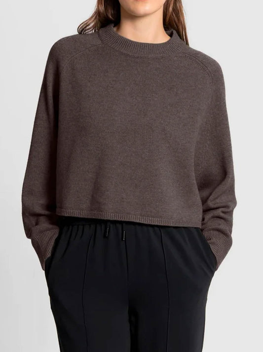 Image of a model wearing Outerwear. Product name - FIELDS BATWING SADDLE SHOULDER PULLOVER in Coffee Bean colour by brand - Fields Knitwear