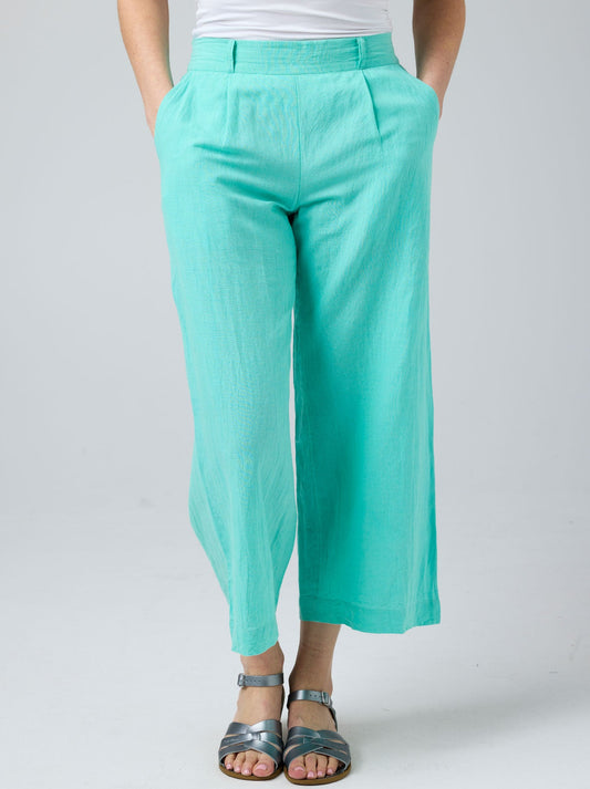 Image of a model wearing Pants. Product name - Cake Hayley Linen Pant in Green colour by brand - Cake