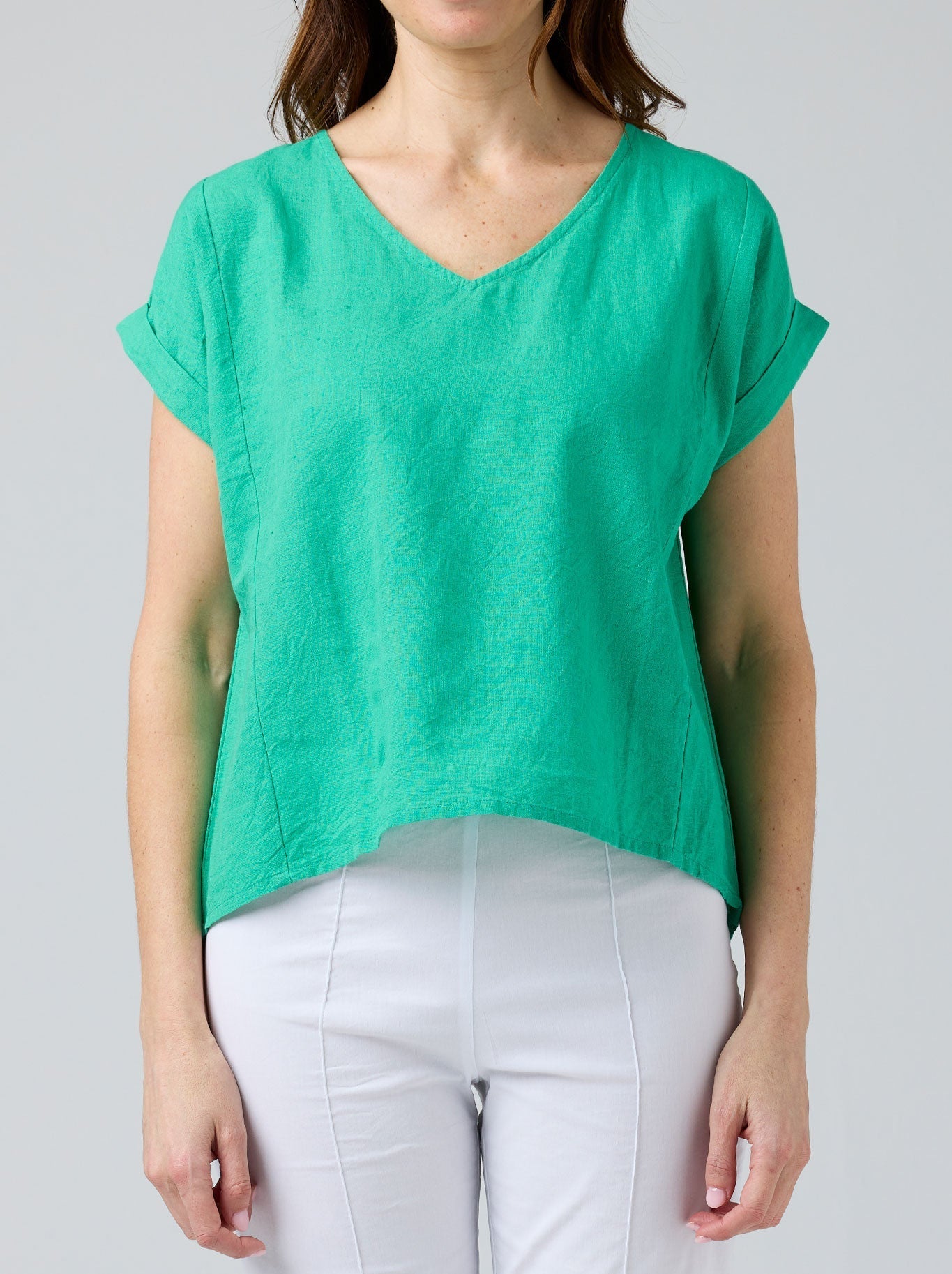 Image of a model wearing Tops. Product name - CAKE TALIA LINEN TOP in Green colour by brand - Cake