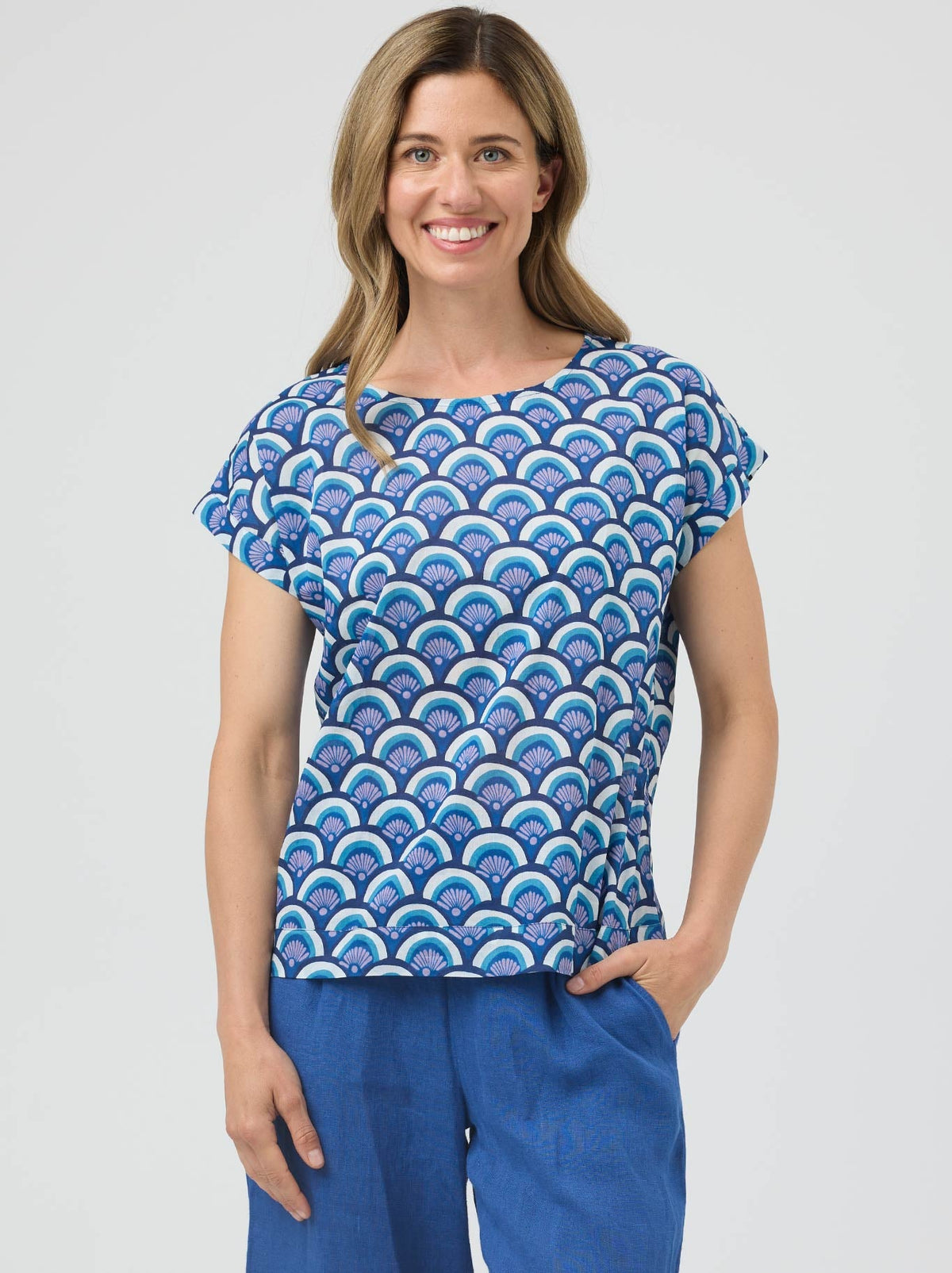 Image of a model wearing Tops. Product name - Cake Vicky Round Neck in Blue Arches colour by brand - Cake