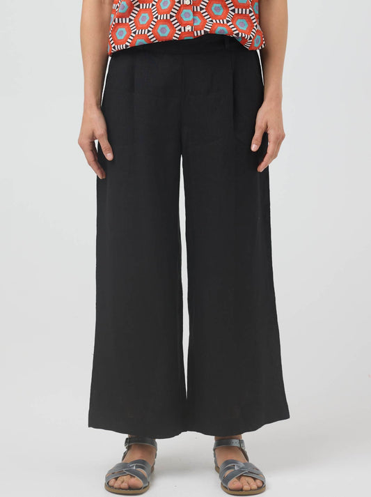 Image of a model wearing Pants. Product name - Cake Hayley Linen Pant in Black colour by brand - Cake