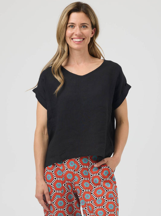Image of a model wearing Tops. Product name - Cake Talia Linen Top in Black colour by brand - Cake