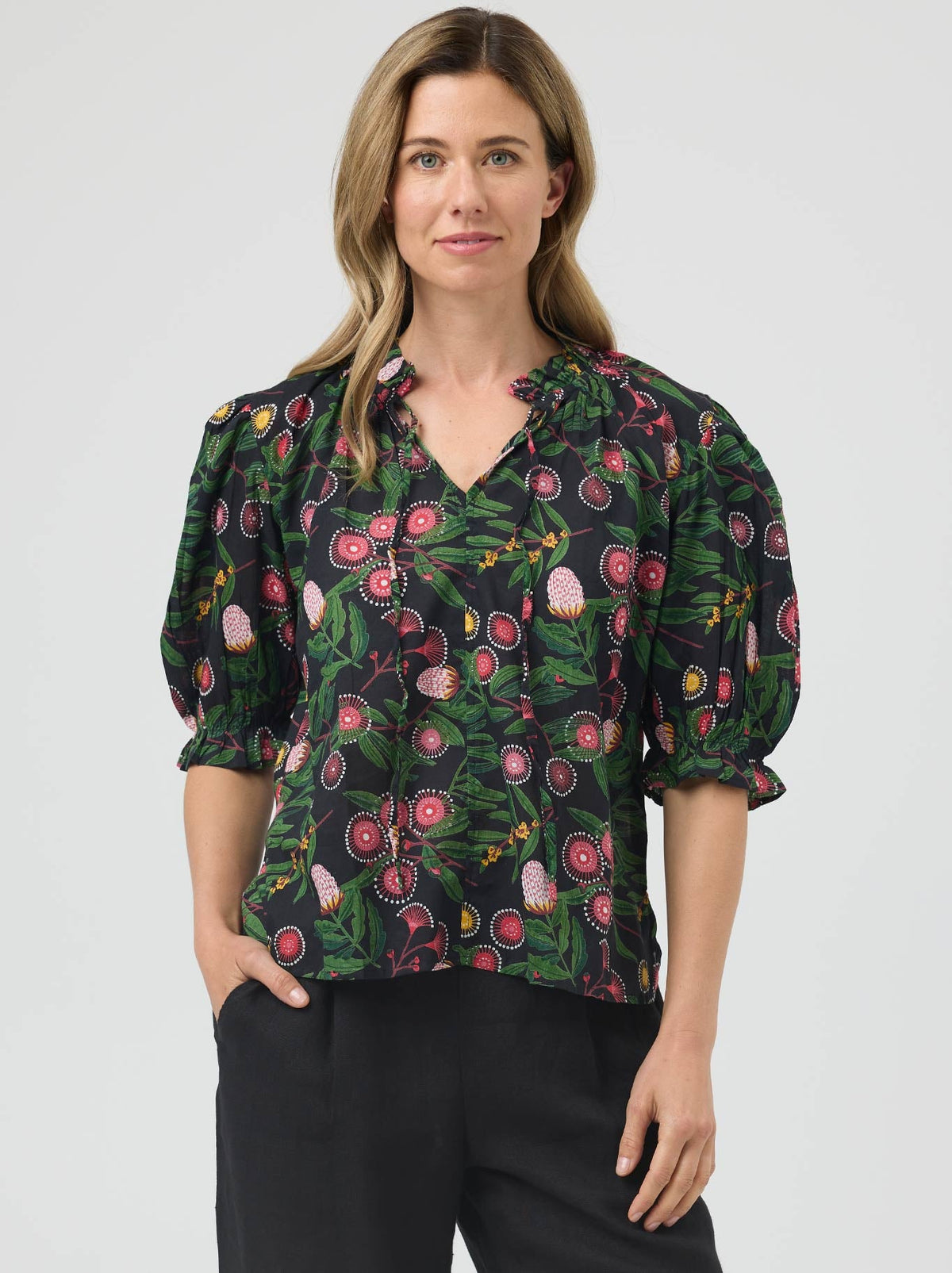 Image of a model wearing Tops. Product name - Cake Tie Neck Blouse in Native colour by brand - Cake