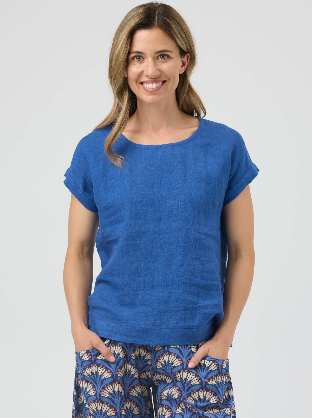 Image of a model wearing Tops. Product name - Cake Vicky Linen Top in Blue colour by brand - Cake