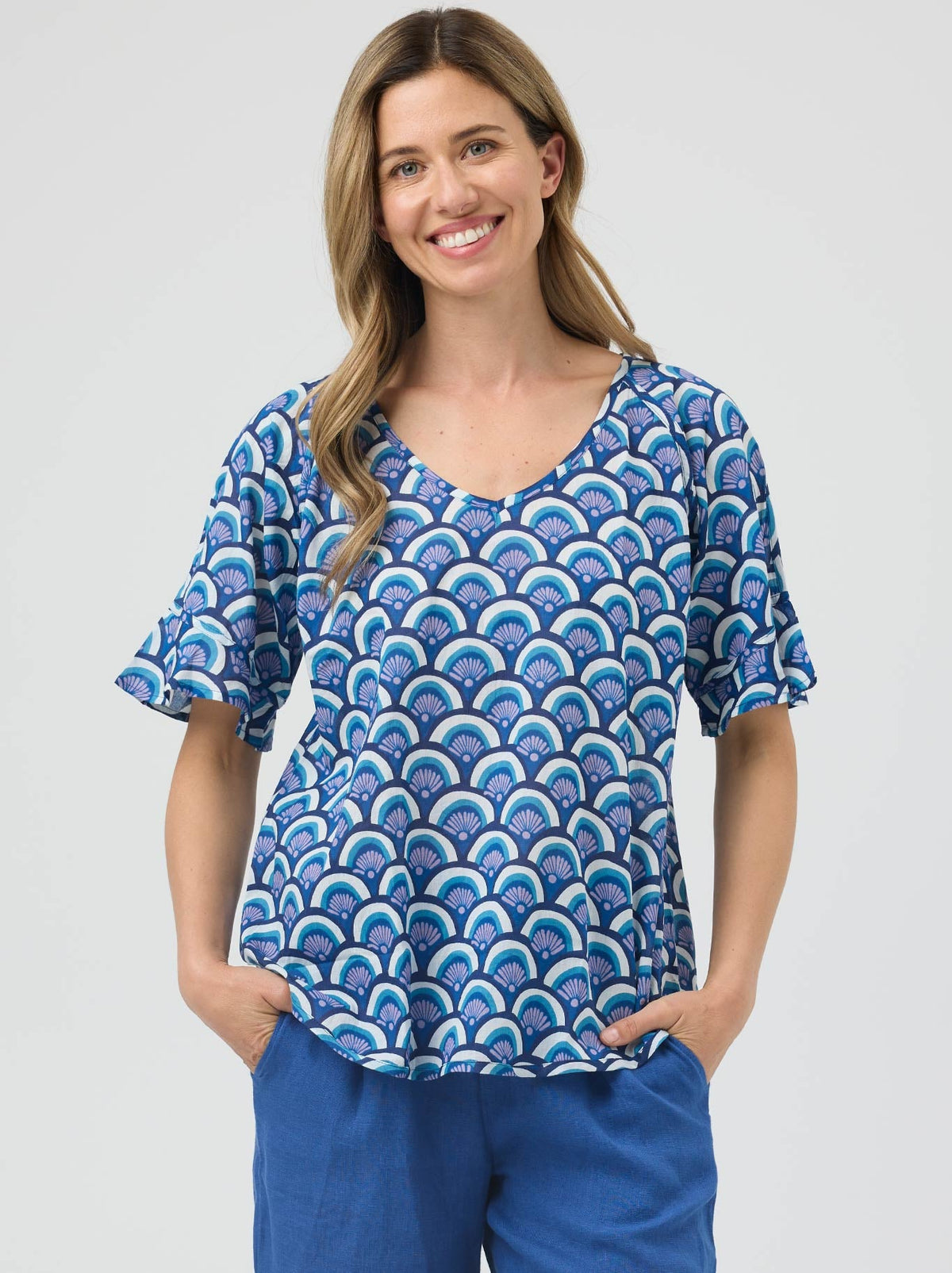 Image of a model wearing Tops. Product name - Cake Kim Top in Blue Arches colour by brand - Cake