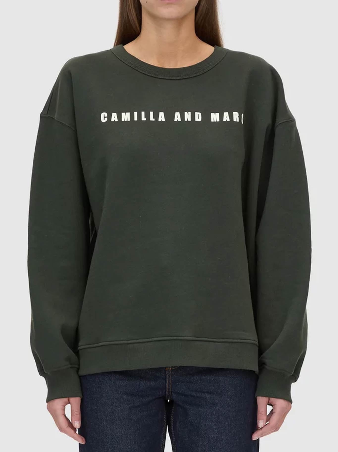 Image of a model wearing Tops. Product name - CAMILLA AND MARC ANCA GRAPHIC SWEATER in Green colour by brand - Camilla And Marc