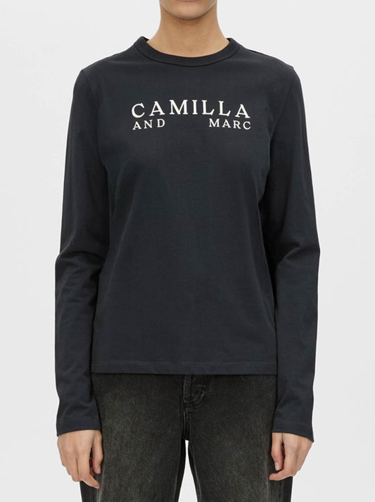 Image of a model wearing Tops. Productname: CAMILLA AND MARC ERA LONG SLEEVE GRAPHIC TEE in Navy colour by brand - Camilla And Marc
