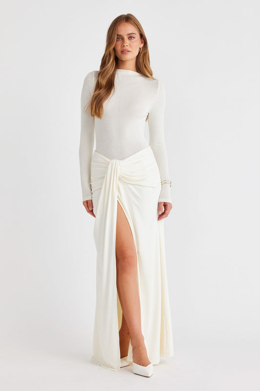 Image of a model wearing Skirts. Productname: SNDYS CANTARIOS JERSEY MAXI SKIRT in Off White colour by brand - SNDYS