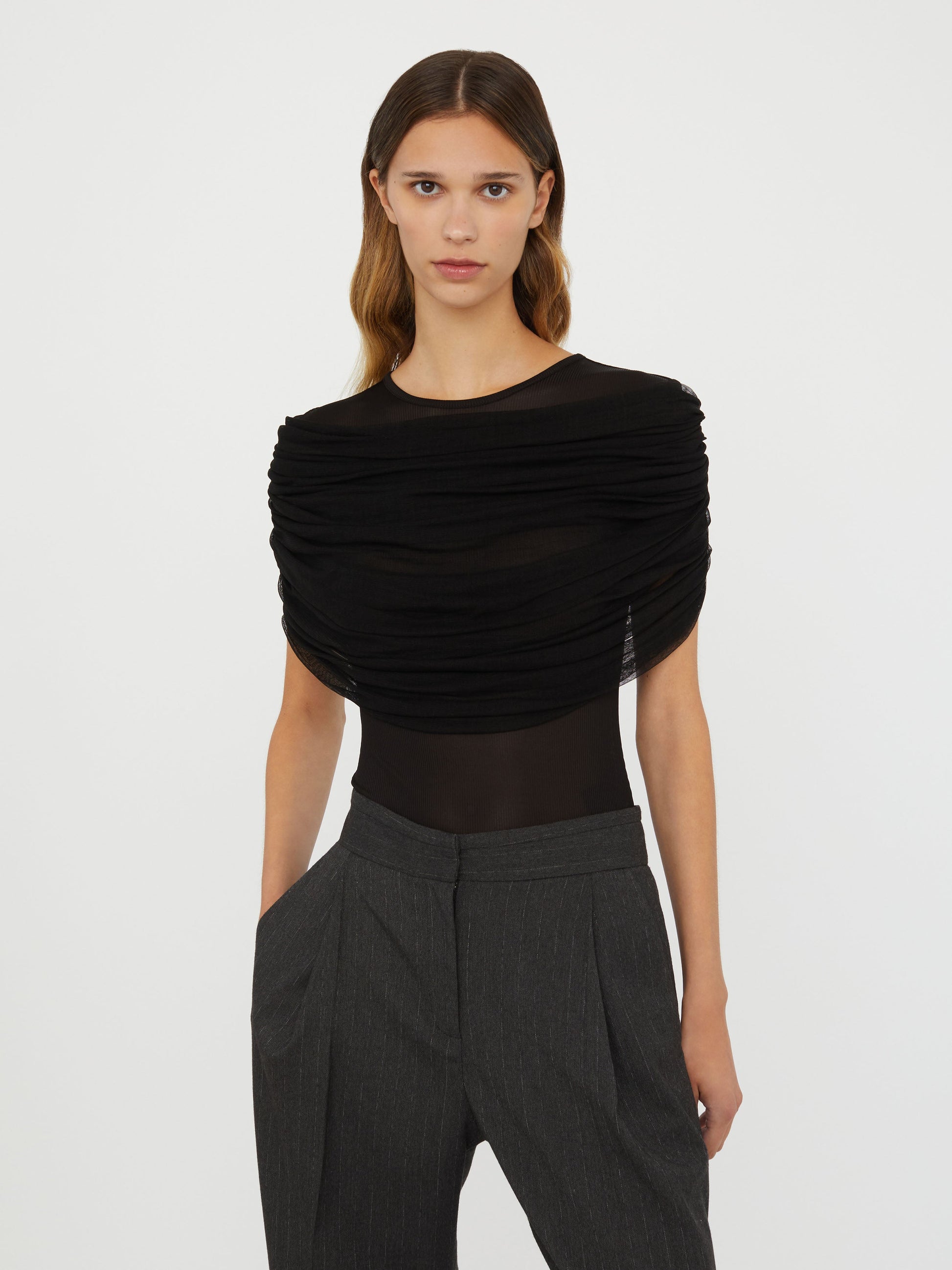 Image of a model wearing Tops. Productname: Embargo Sonora Veiled Tee in Black colour by brand - Embargo