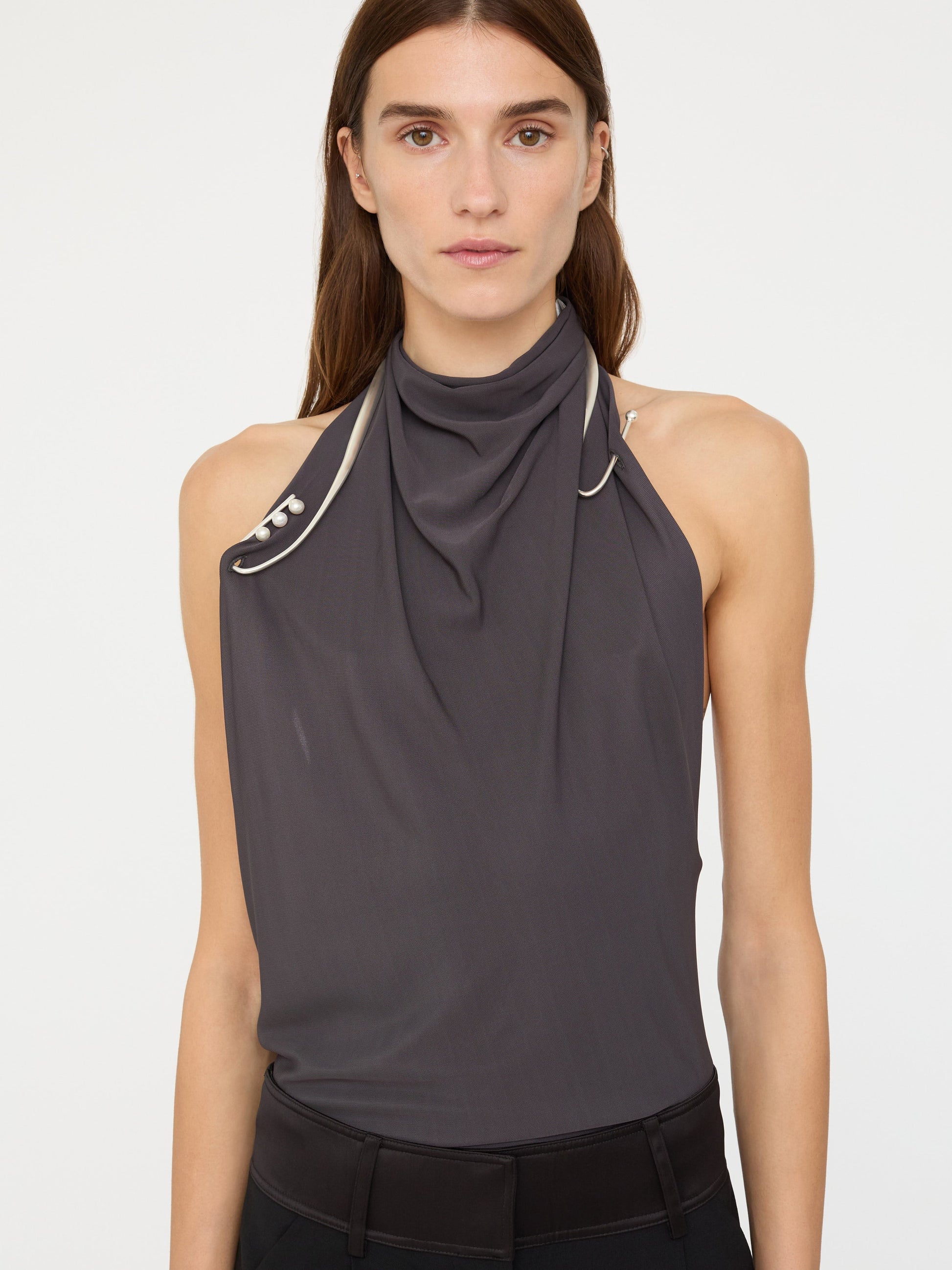 Image of a model wearing Tops. Product name - Levitate Halter Top in Charcoal colour by brand - Christopher Esber