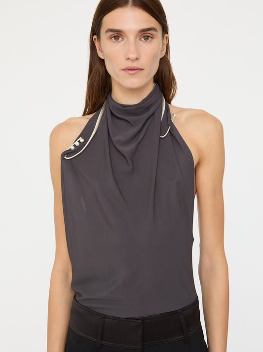 Image of a model wearing Tops. Product name - Levitate Halter Top in Charcoal colour by brand - Christopher Esber