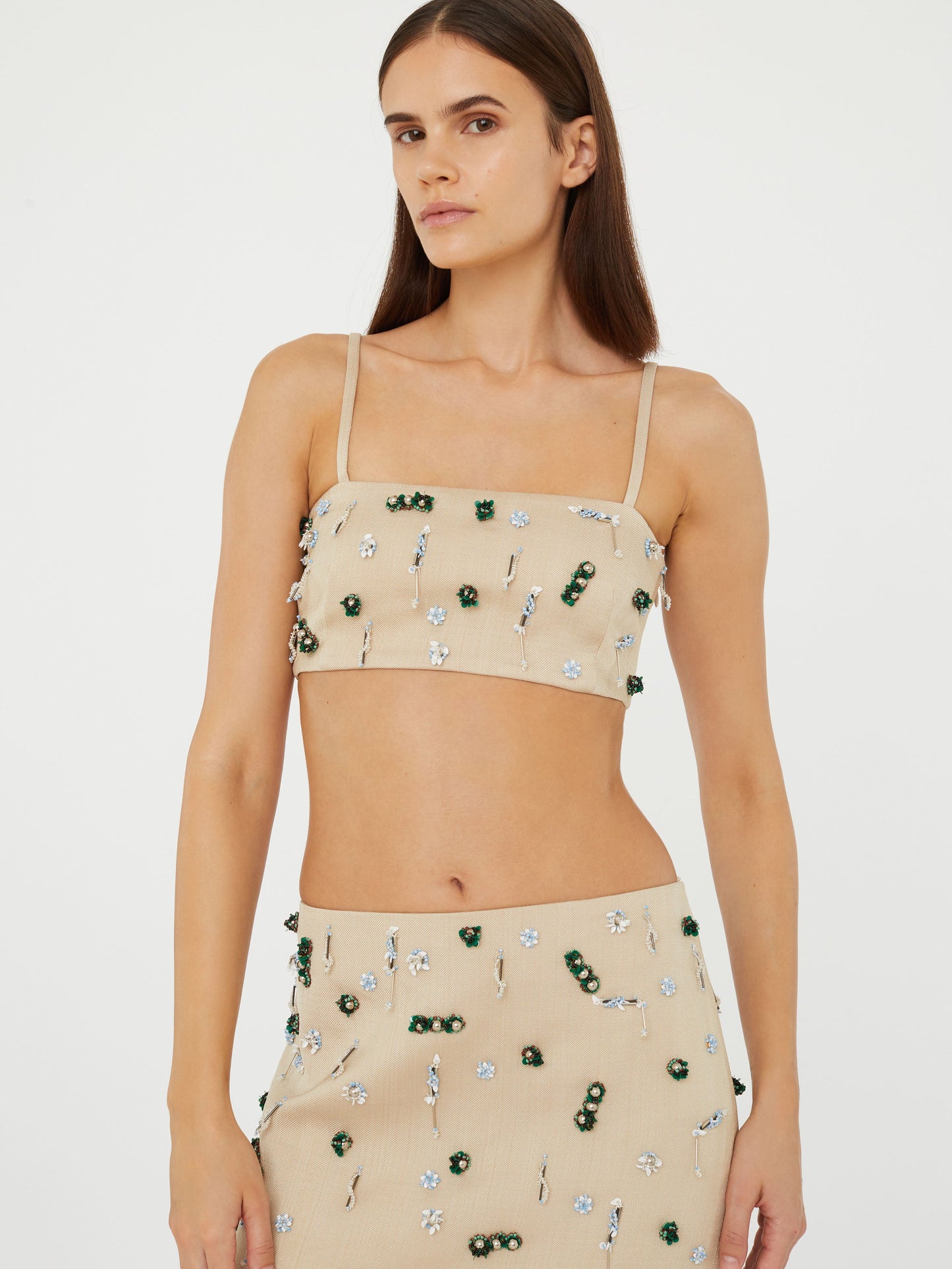 Image of a model wearing Tops. Product name - Embla Beaded Bandeau in Multi colour by brand - Christopher Esber