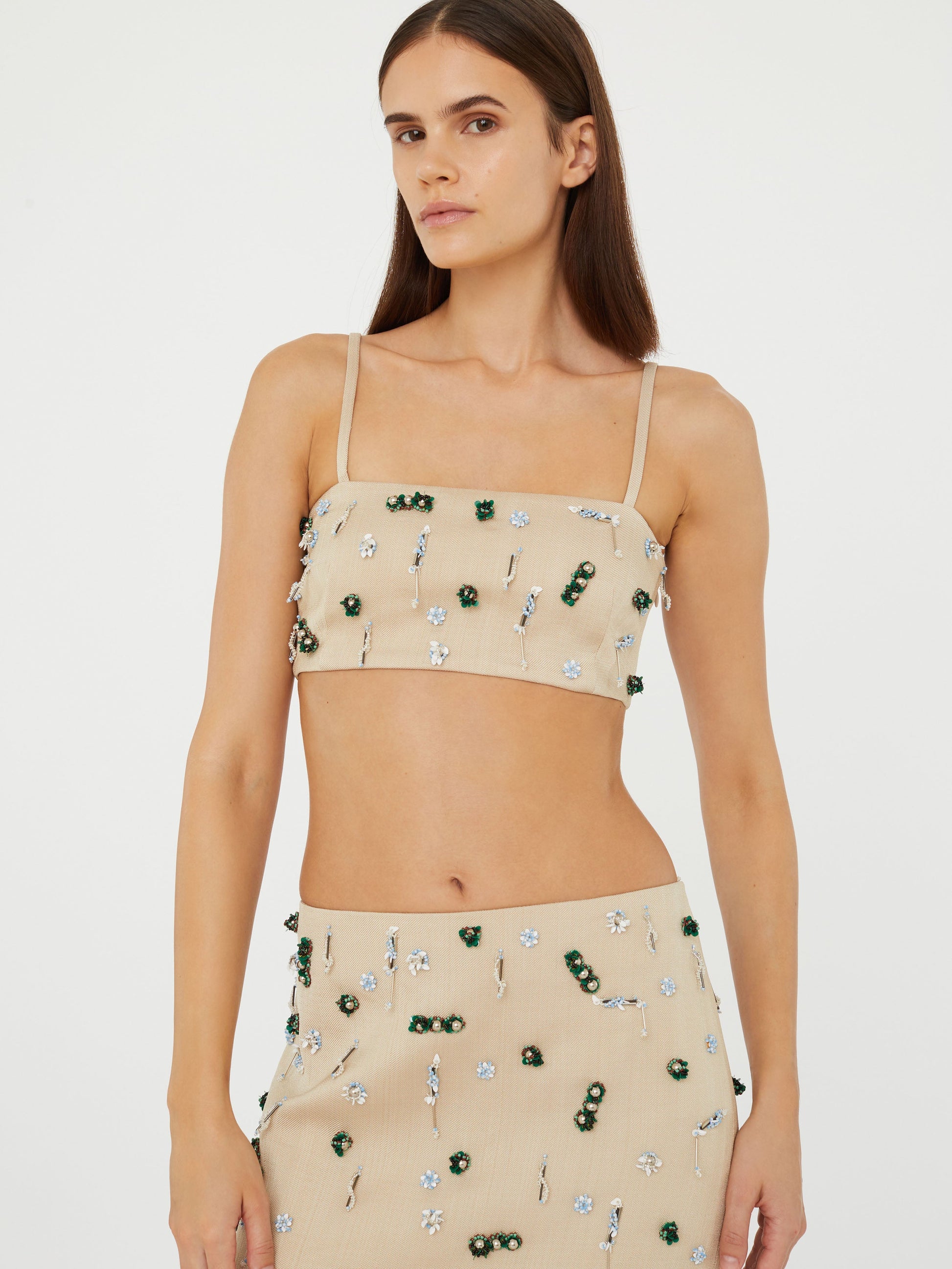 Image of a model wearing Tops. Product name - Embla Beaded Bandeau in Multi colour by brand - Christopher Esber