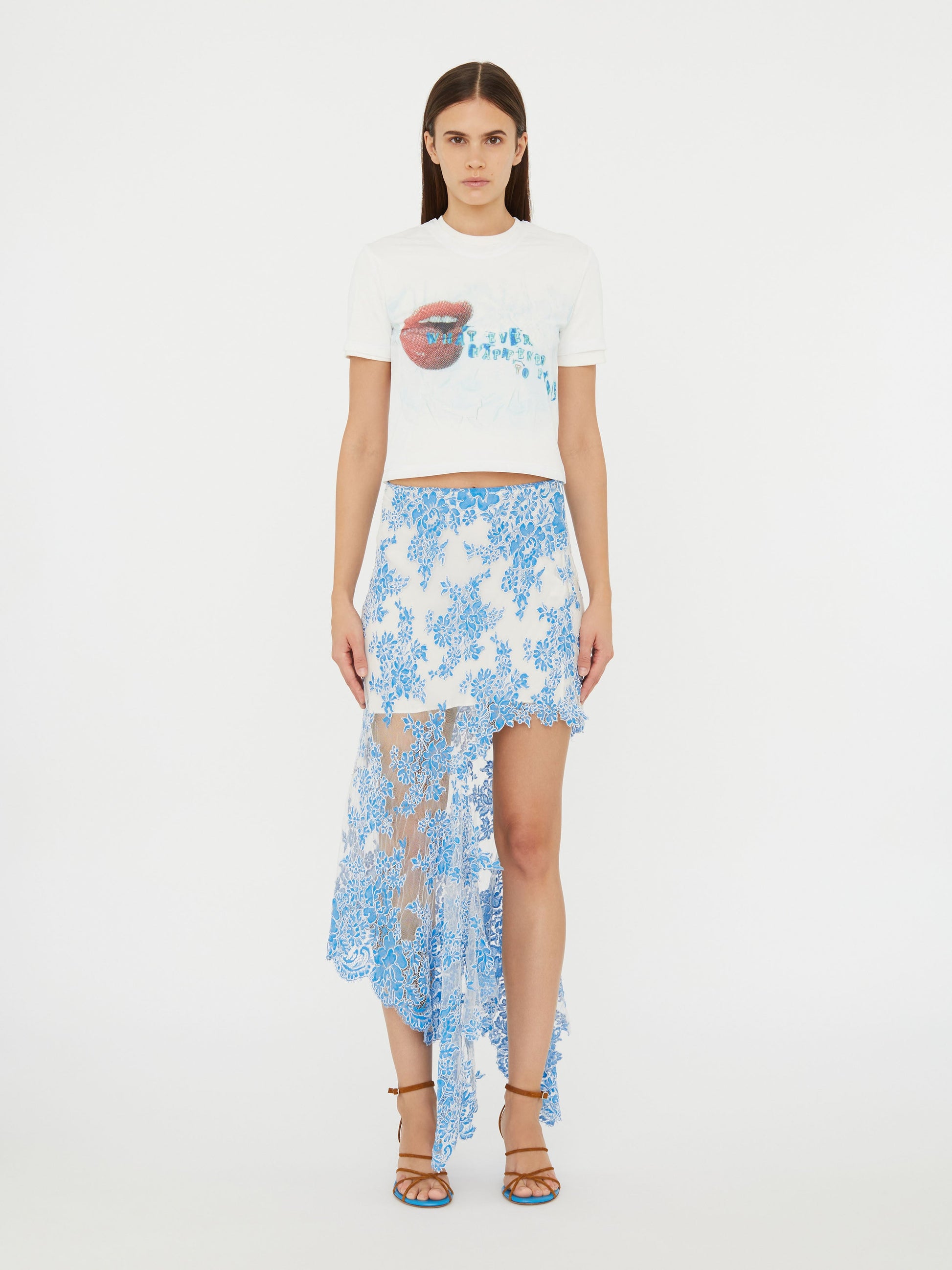 Image of a model wearing Skirts. Product name - Floating Lace Asymmetric Skirt in Blue colour by brand - Christopher Esber