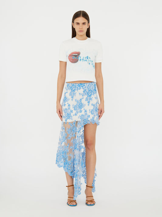 Image of a model wearing Skirts. Product name - Floating Lace Asymmetric Skirt in Blue colour by brand - Christopher Esber