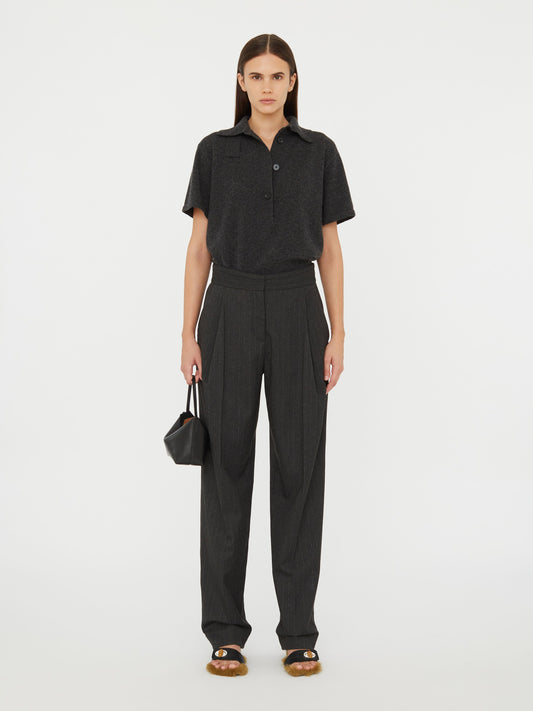 Image of a model wearing Pants. Product name - Cuffed Tailored Trouser in Stripe colour by brand - Christopher Esber