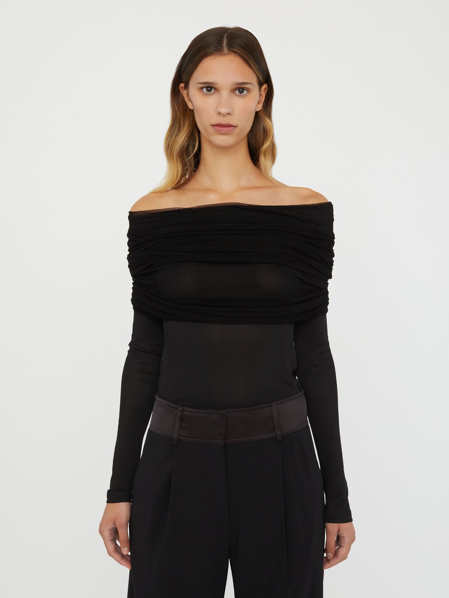 Image of a model wearing Tops. Productname: Christopher Esber Sonora Veiled Long Sleeve Top in Black colour by brand - Christopher Esber