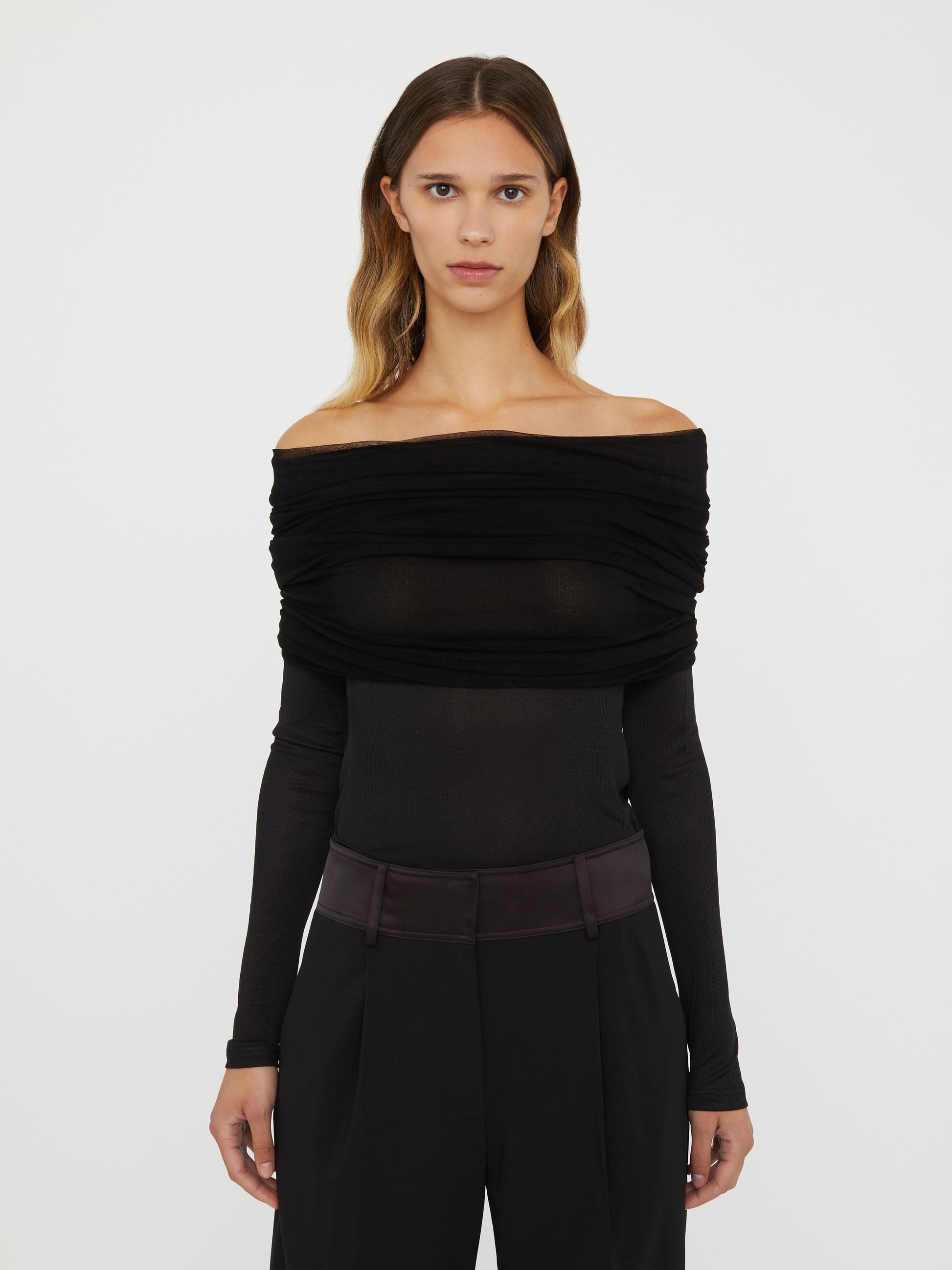 Image of a model wearing Tops. Productname: Christopher Esber Sonora Veiled Long Sleeve Top in Black colour by brand - Christopher Esber