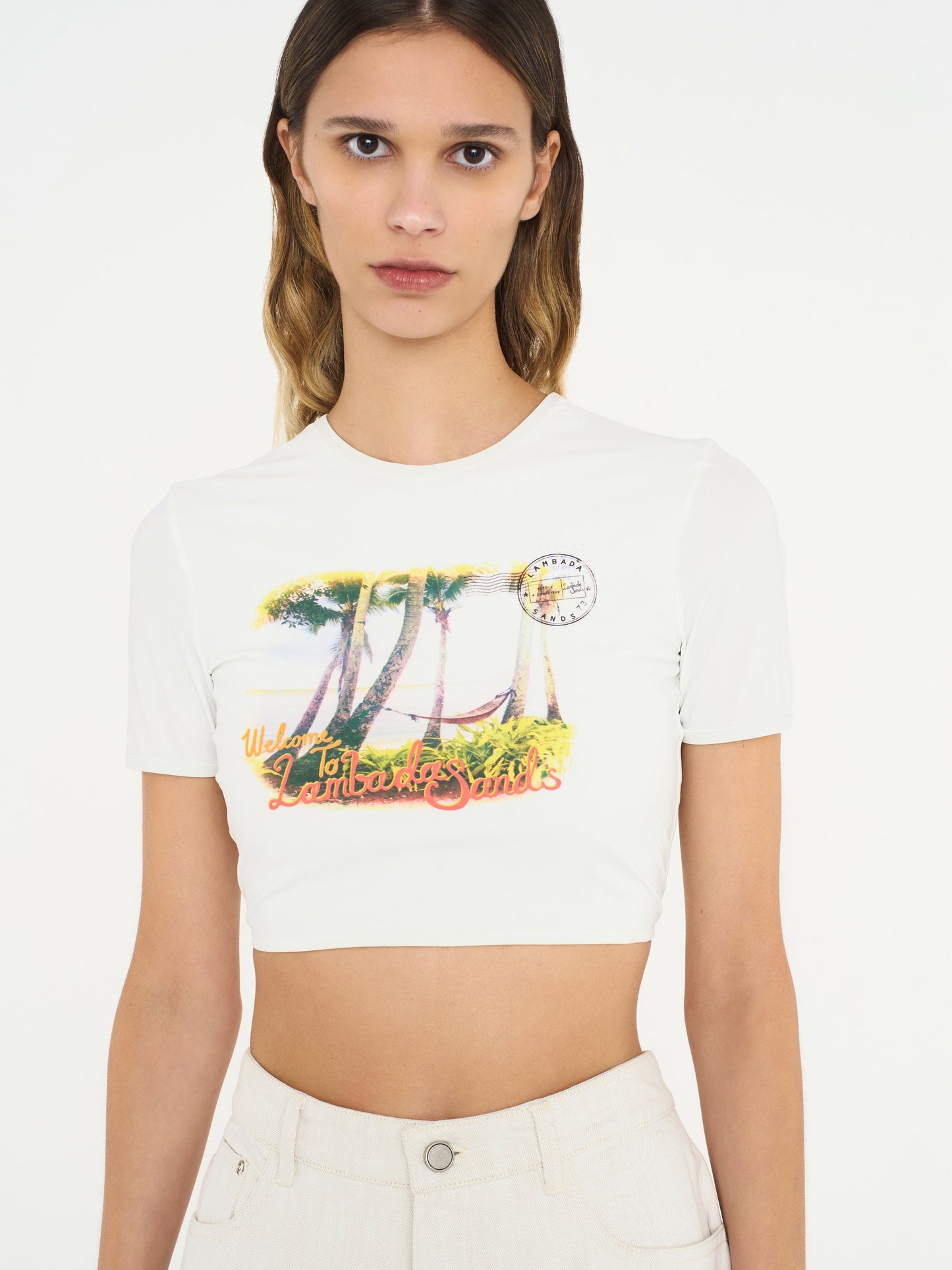 Image of a model wearing Tops. Product name - Lambada Sands Backless Knot Tie Tee in White colour by brand - Christopher Esber