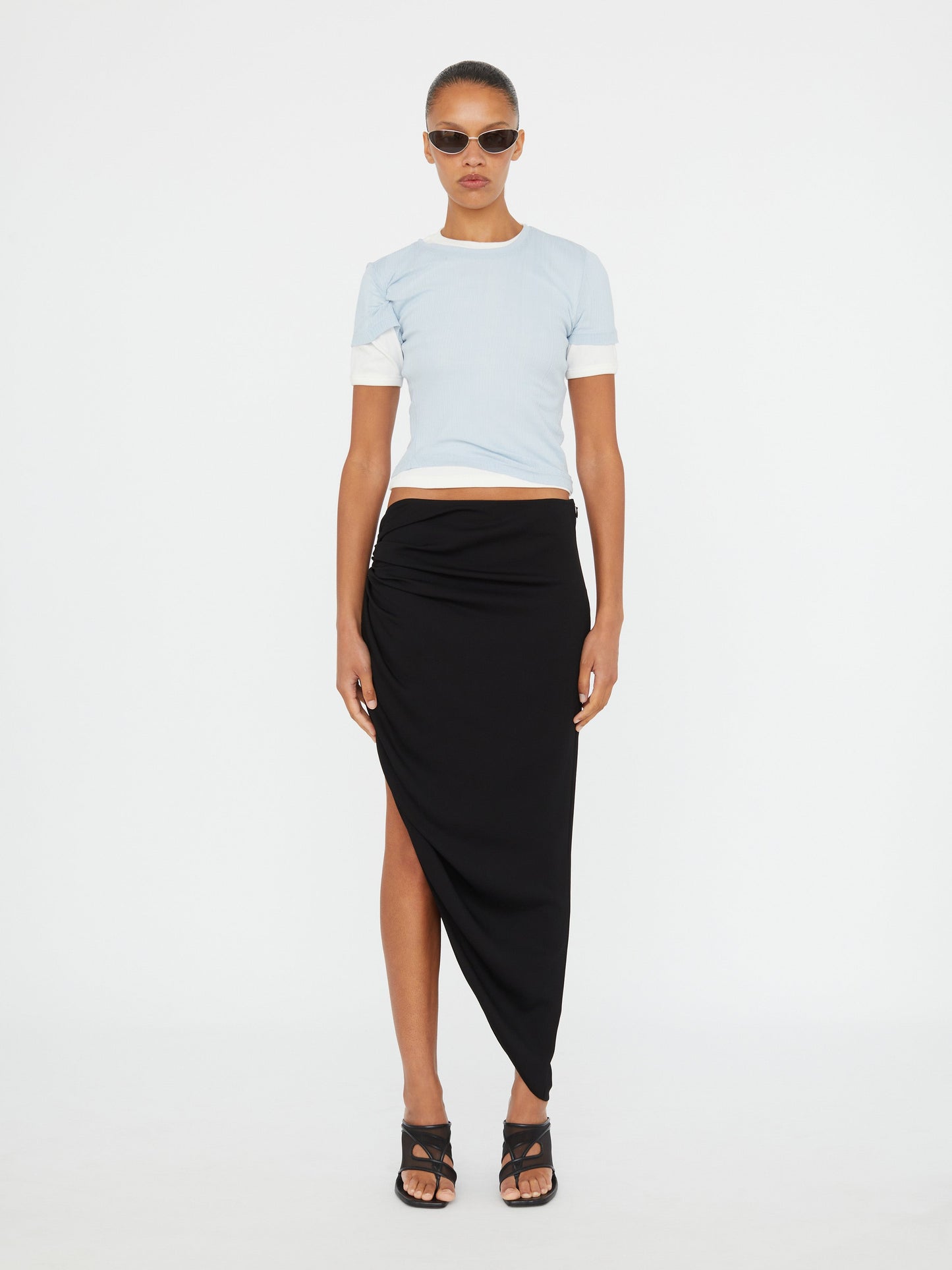 Image of a model wearing Skirts. Product name - Crescent Gather Skirt in Skirt colour by brand - Christopher Esber