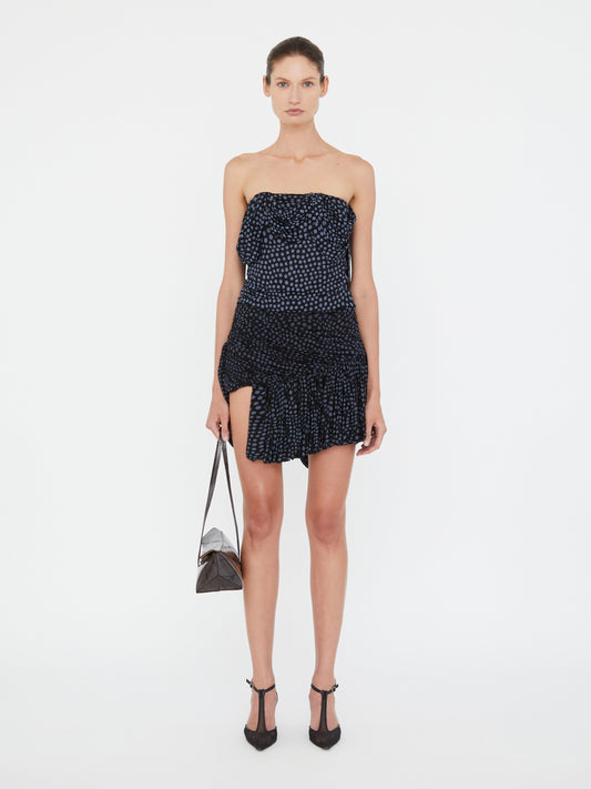 Image of a model wearing Skirts. Product name - Gyre Draped Mini Skirt in Skirt colour by brand - Christopher Esber