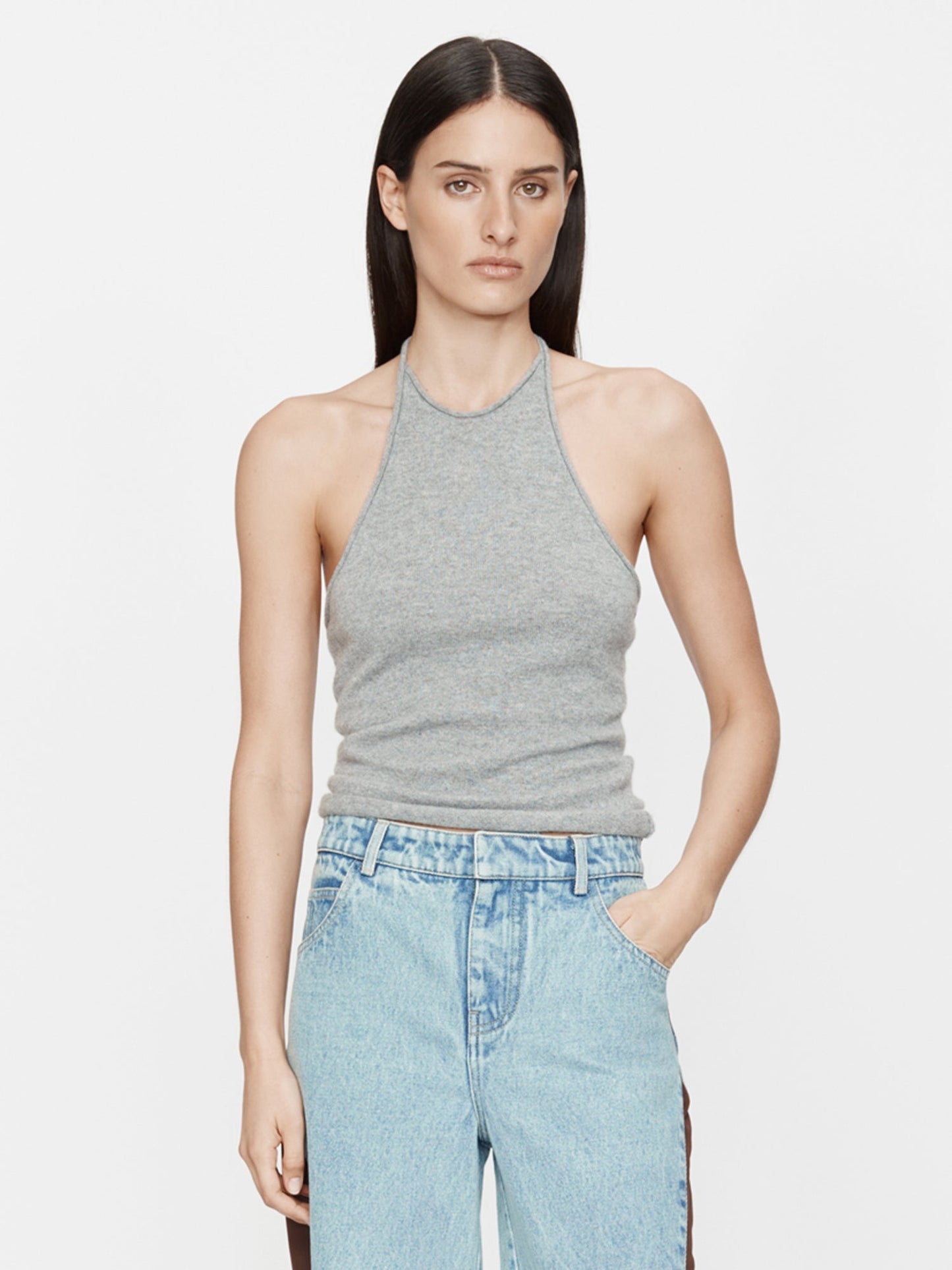 Image of a model wearing Tops. Product name - Cashmere Rae Halter Tank in Marle colour by brand - Christopher Esber