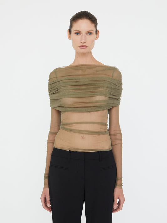 Image of a model wearing Tops. Product name - Veiled Top in Eucalypt colour by brand - Christopher Esber
