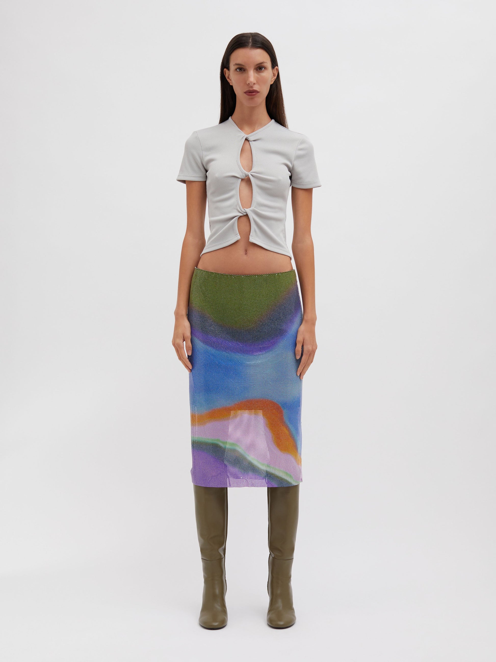 Image of a model wearing Skirts. Product name - Aura Glowmesh Midi Skirt in Print colour by brand - Embargo