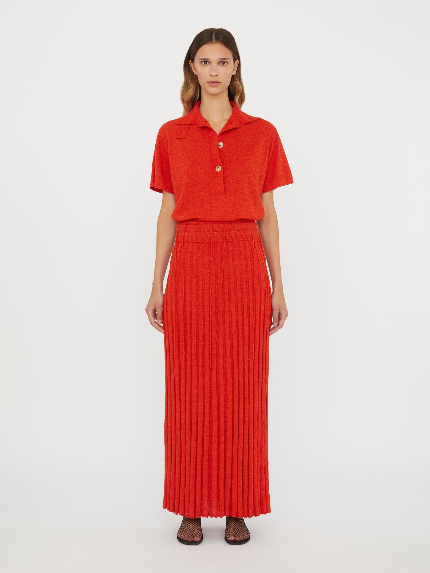 Image of a model wearing Skirts. Productname: Christopher Esber Straccio Knitted Skirt in Red colour by brand - Christopher Esber