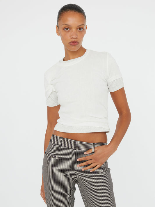 Image of a model wearing Tops. Product name - Ribbed Overlay Loophole Tee in Grey colour by brand - Christopher Esber
