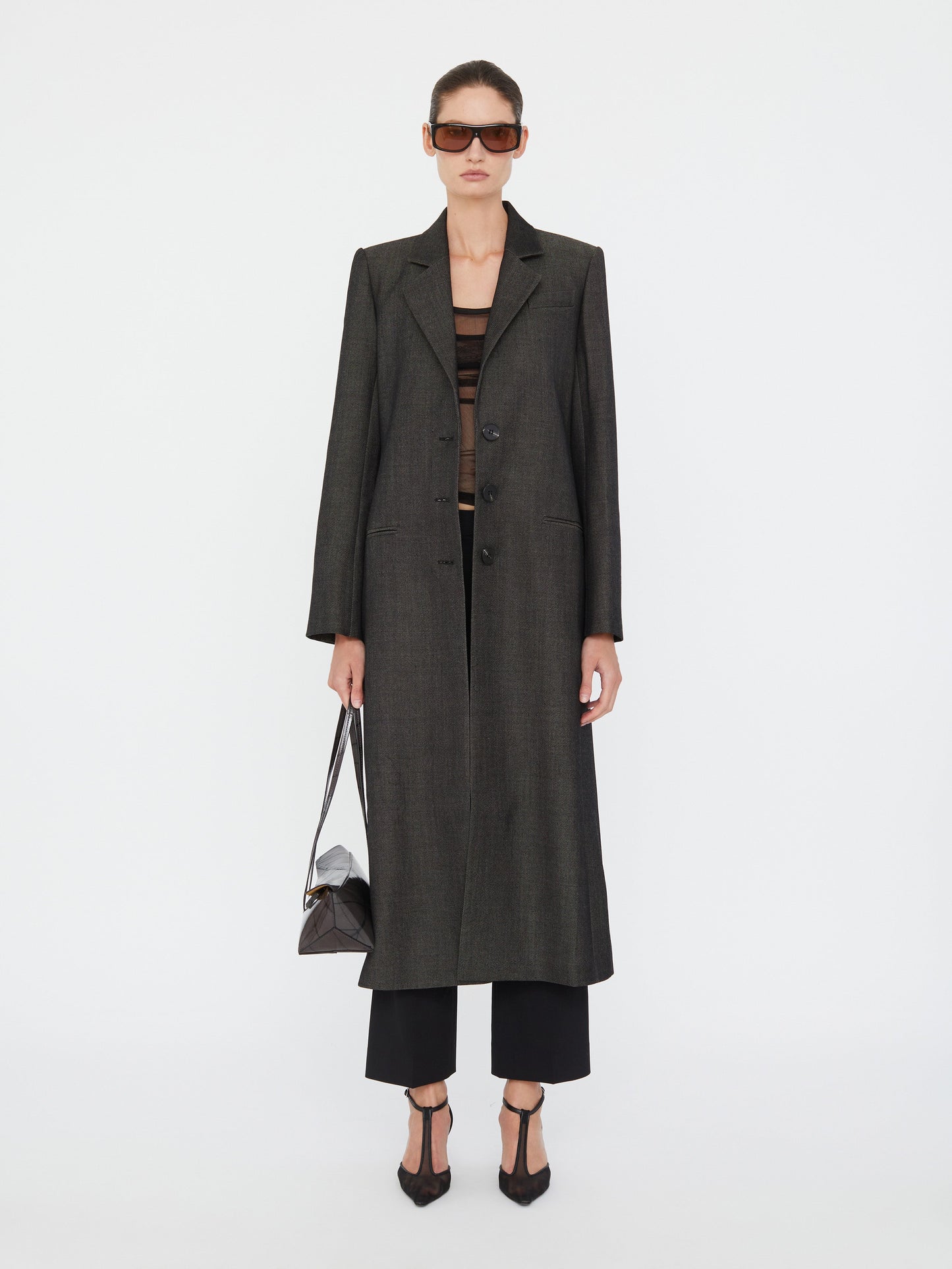 Image of a model wearing Outerwear. Productname: Christopher Esber Talus Twill Coat in Coat colour by brand - Christopher Esber