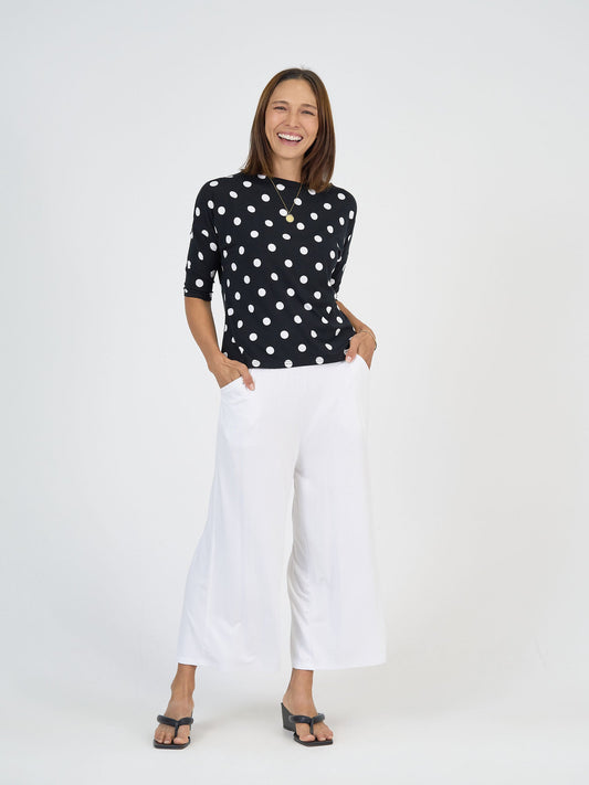 Image of a model wearing Pants. Product name - Ciara 7/8 Length Bamboo Culottes in White colour by brand - Lou Lou