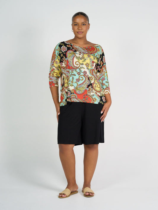 Image of a model wearing Tops. Product name - Camila 3/4 Sleeve Bamboo Top Noosa Pucci Print in Noosa Pucci colour by brand - Lou Lou