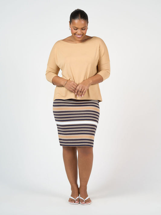 Image of a model wearing Skirts. Product name - Midi Bamboo Whitney Tube Skirt Stripe in Stripe colour by brand - Lou Lou