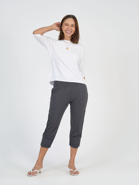 Image of a model wearing Pants. Product name - Perry Bamboo Cropped Pants Steel in Steel colour by brand - Lou Lou