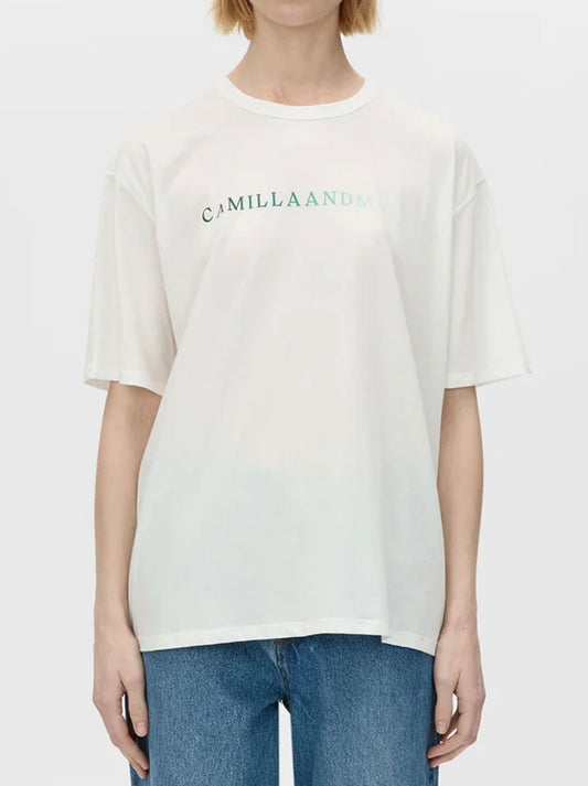 Image of a model wearing Tops. Productname: CAMILLA AND MARC NAVARRO LOGO TEE in White Forest colour by brand - Camilla And Marc