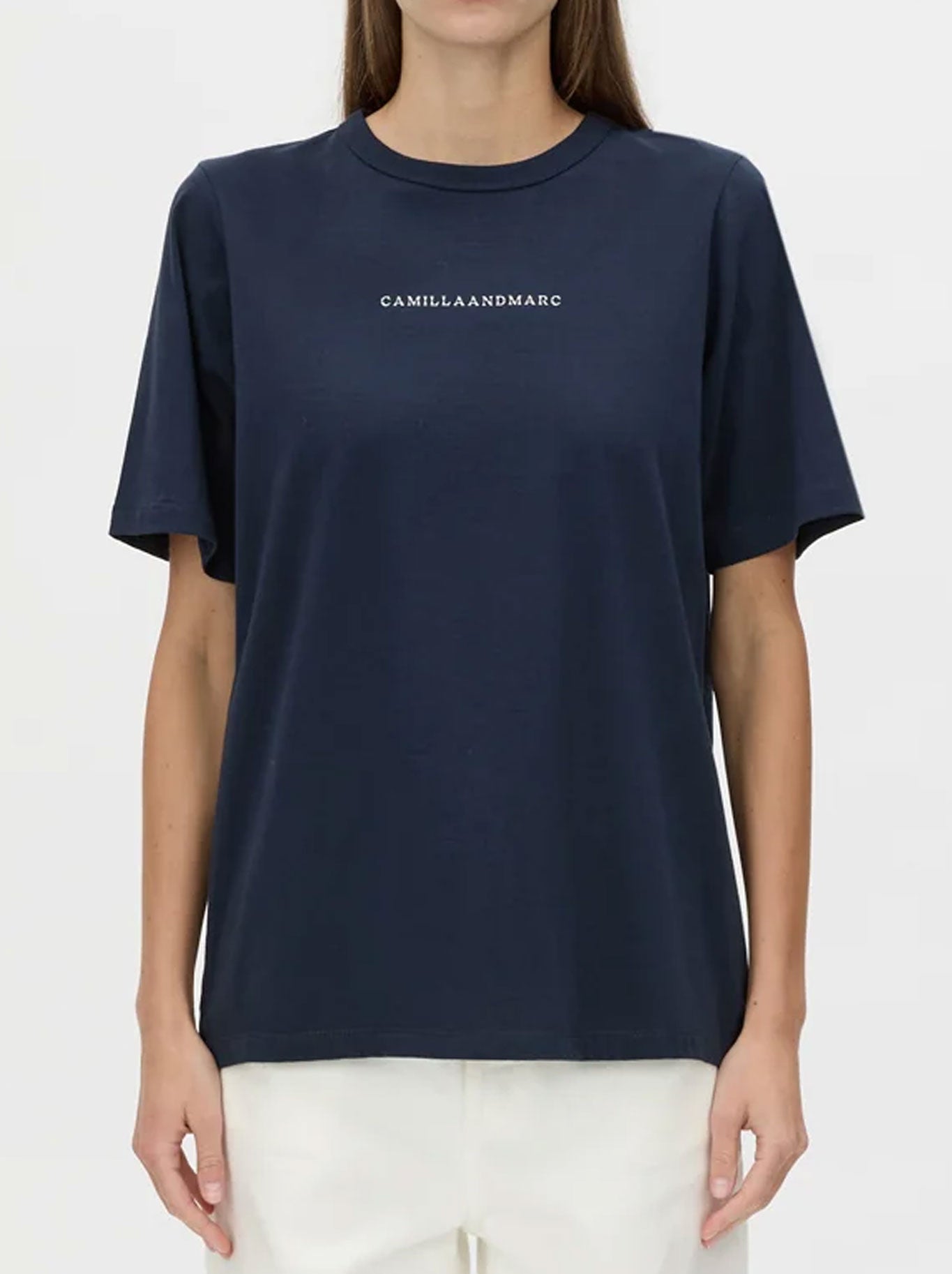 Image of a model wearing Tops. Productname: CAMILLA AND MARC SUVERO LOGO TEE in Navy colour by brand - Camilla And Marc