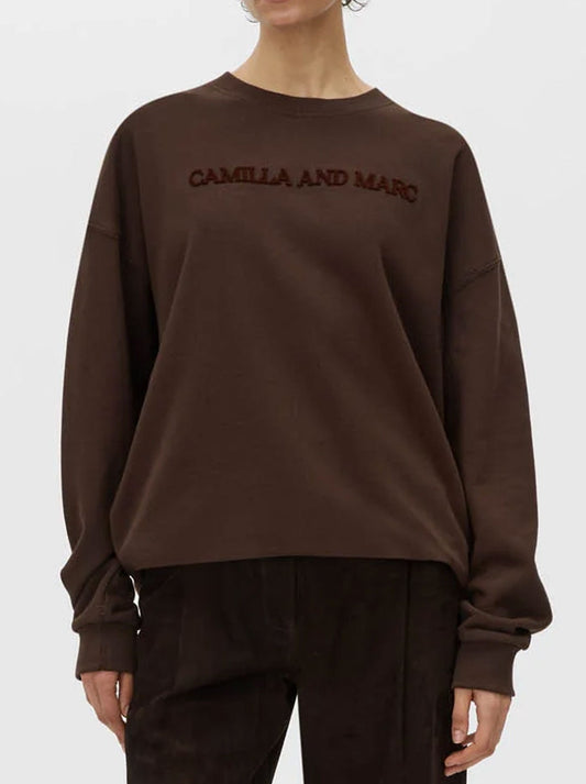 Image of a model wearing Tops. Productname: CAMILLA AND MARC TIA FLOCKING LOGO CREW in Oyster colour by brand - Camilla And Marc