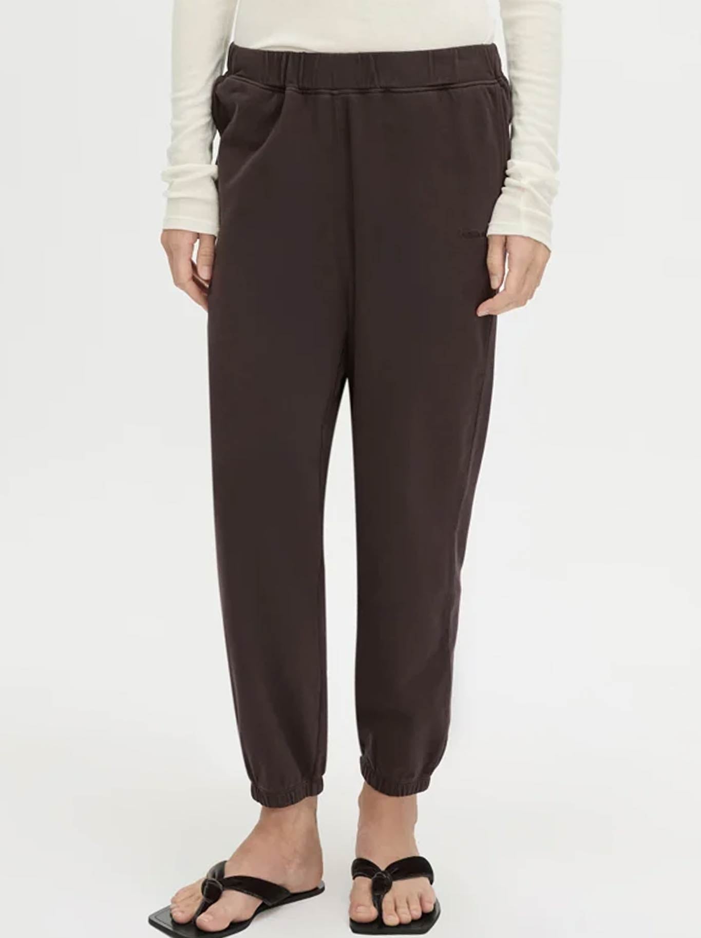 Image of a model wearing Pants. Product name - CAMILLA AND MARC THOME EMB TRACK PANT in Hickory colour by brand - Camilla And Marc