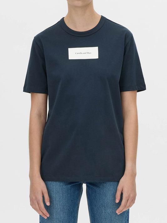 Image of a model wearing Tops. Product name - CAMILLA AND MARC WILDE PRINT TEE in Navy White colour by brand - Camilla And Marc