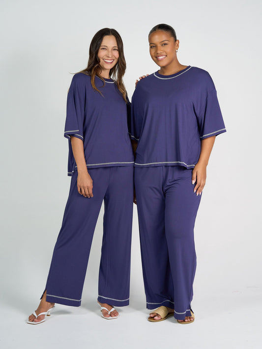 Image of a model wearing Pants. Product name - Carey Bamboo Culotte Blue in Blue colour by brand - Lou Lou