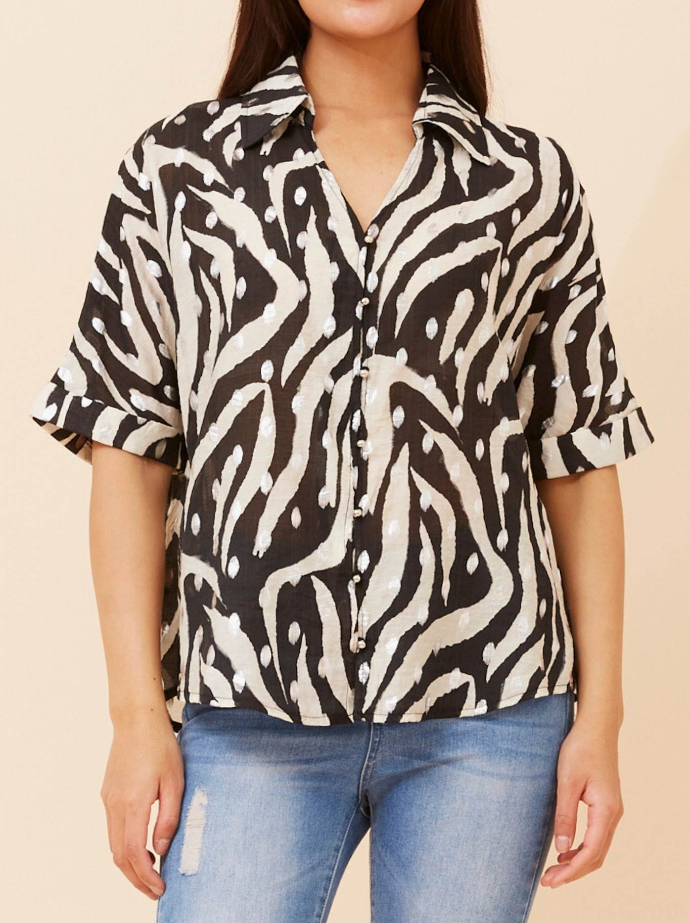 Image of a model wearing Tops. Productname: Caroline K Morgan Animal Print Top With Foil in Black colour by brand - Caroline K Morgan Pty Ltd