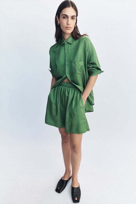Image of a model wearing Shorts. Product name - Celine Shorts Green in Green colour by brand - Blanca Studio